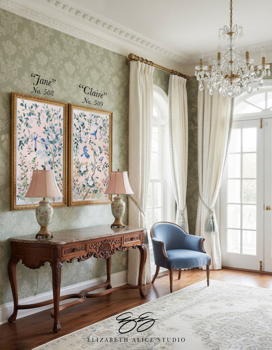 Elegant living room with Elizabeth Alice Studio floral wallpaper, chinoiserie art, vintage console, blue chair & chandelier.