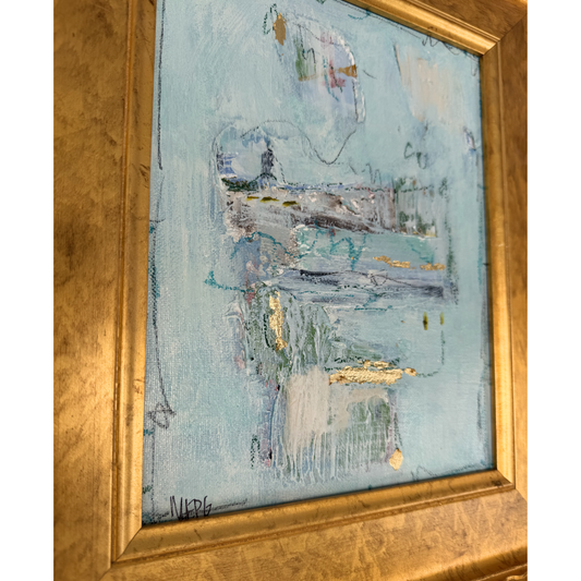Megan Guidry framed art with abstract glacial blue, white, and gold; artist’s signature in the corner.
