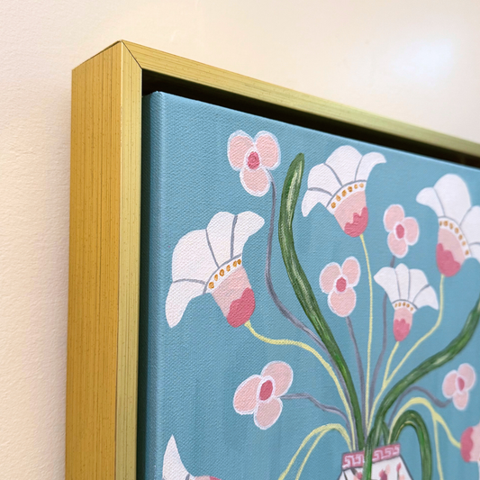 Close-up of an original floral painting with white and pink flowers in a chinoiserie vase art on a blue background.