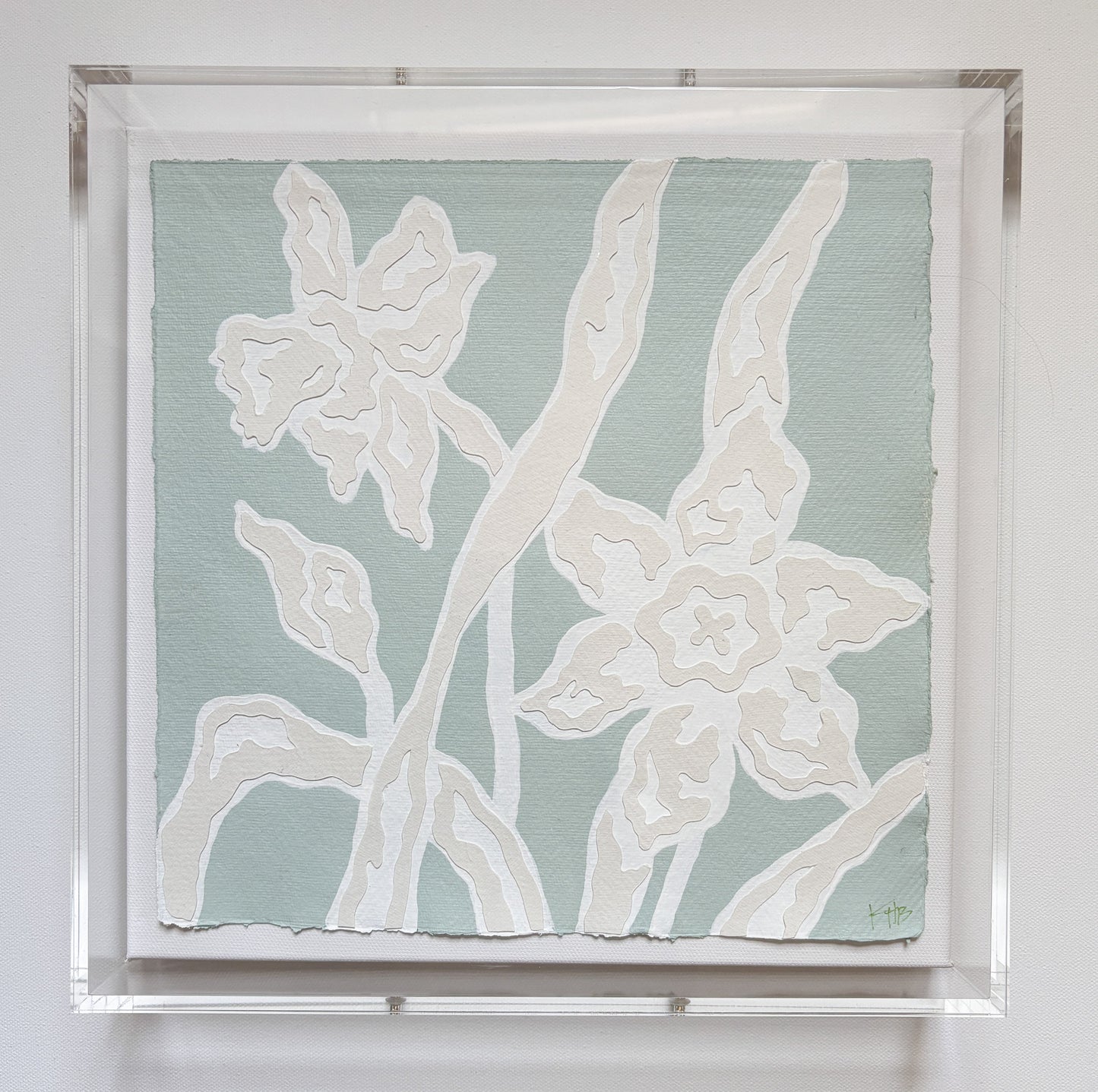 Collaged botanical art by Kendal Blanchard Art: two white outlined flowers on pale green cotton rag, in acrylic box frame.
