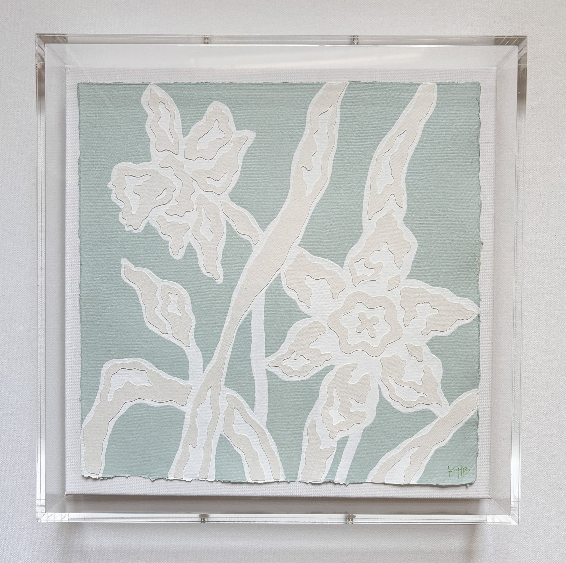 Collaged botanical art by Kendal Blanchard Art: two white outlined flowers on pale green cotton rag, in acrylic box frame.