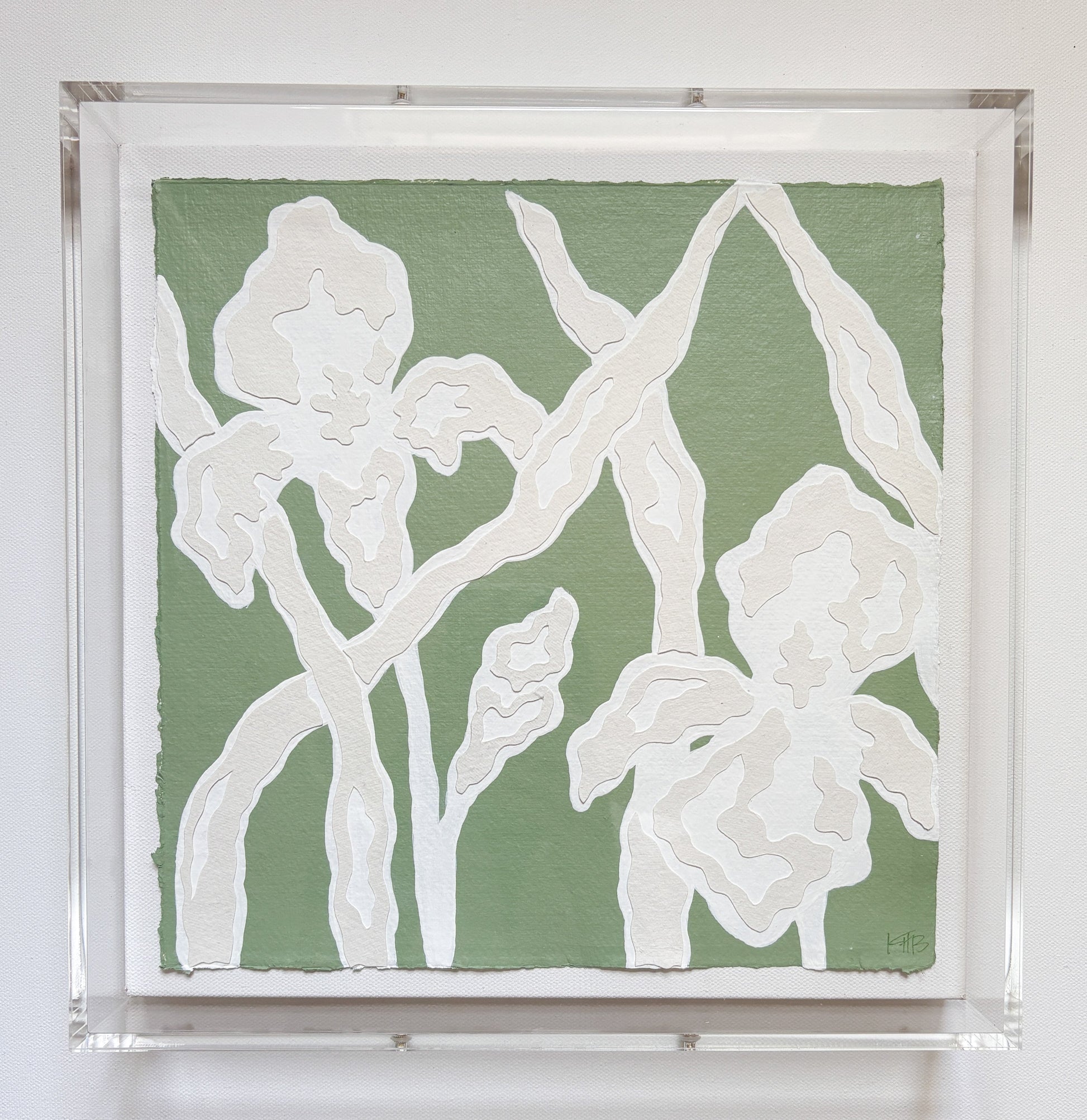 Textured white irises and leaves on green by Kendal Blanchard Art, framed in acrylic on handmade cotton rag paper.