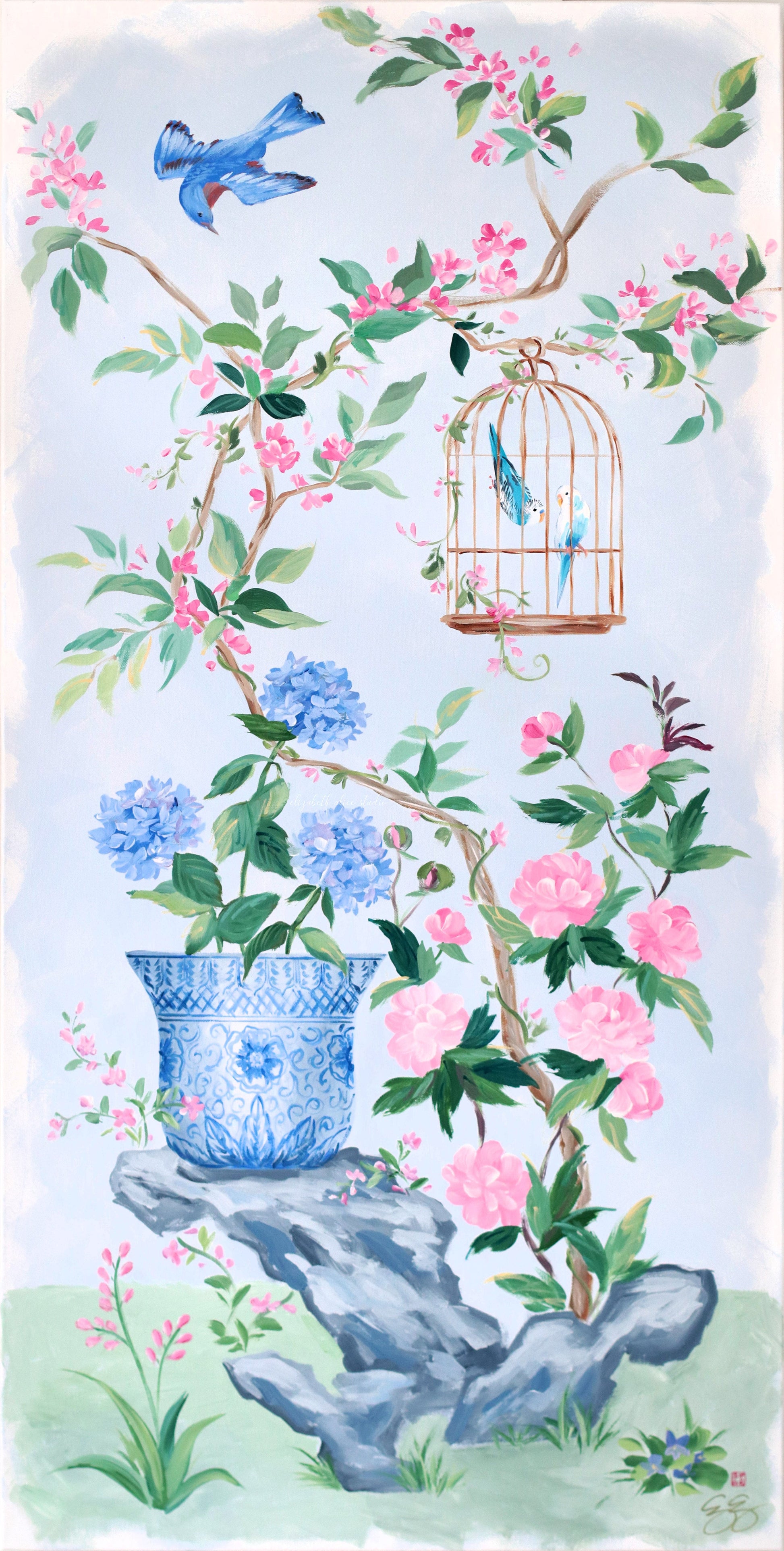 A bluebird flies by a caged bird above a blue hydrangea vase in chinoiserie style by Elizabeth Alice Studio.