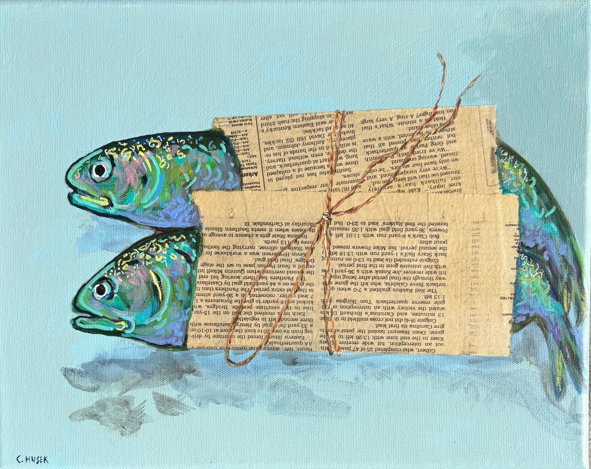 Two colorful sea creatures wrapped in newspaper, by Catherine Husek, painted on a light blue coastal-style background.