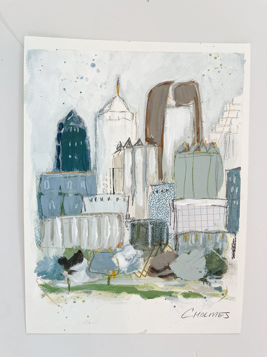 Abstract city skyline with tall buildings in muted colors on 9x12 paper, signed by Christy Holmes.