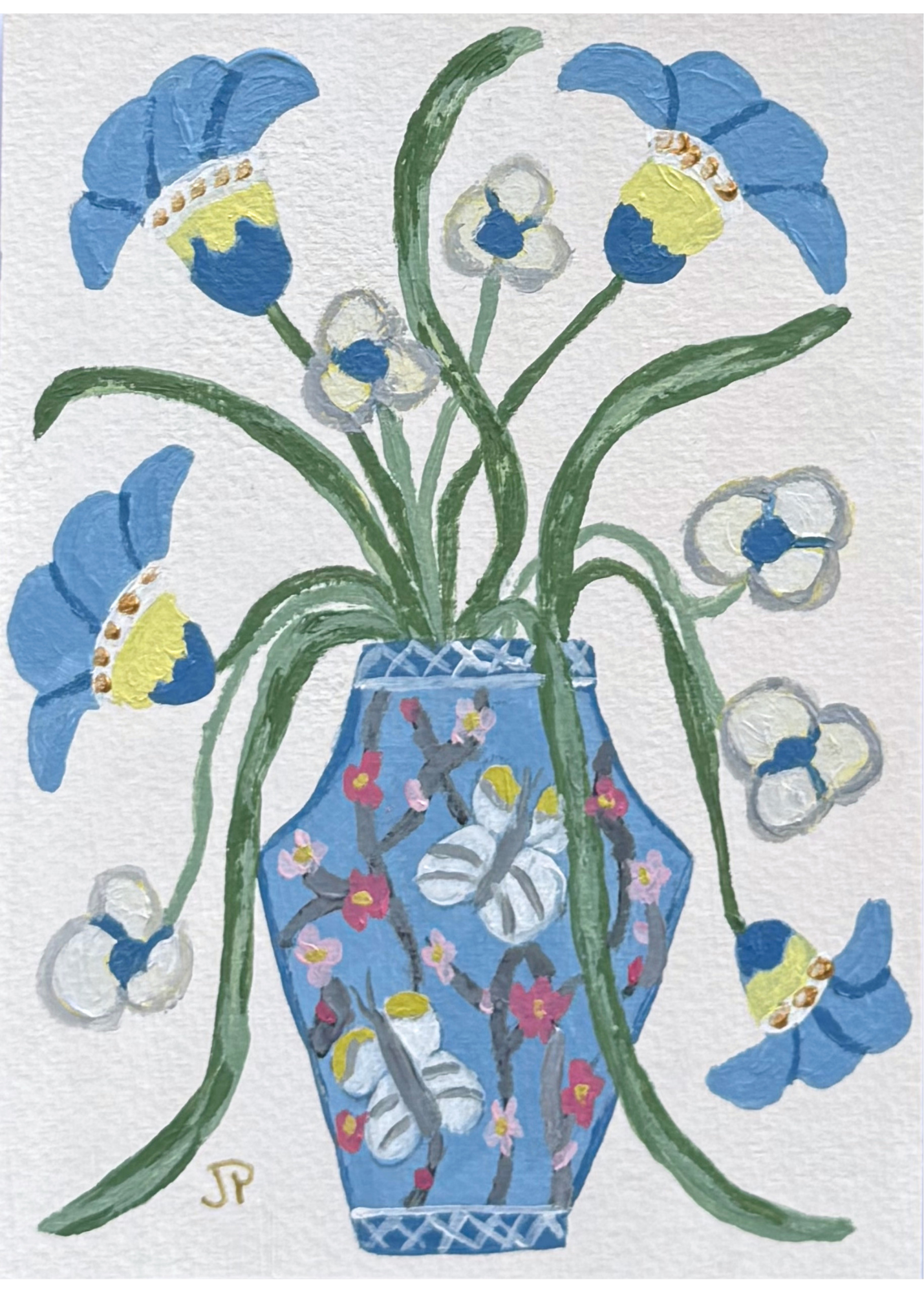 Blue vase with botanical artwork holds whimsical flowers—blue and white blooms with green stems and butterfly designs.