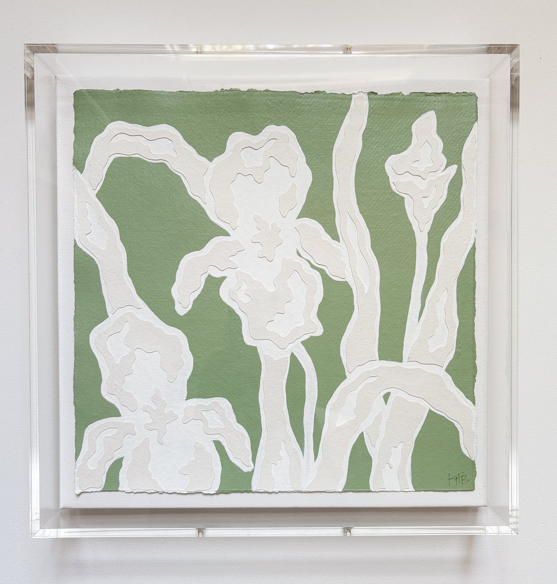 A textured green and white botanical collage of abstract iris flowers by Kendal Blanchard Art, in an acrylic box frame.