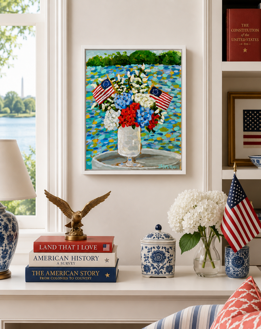 A vase with flags sits on a tray, accented by patriotic wall decor and Lauren Marshall Fine Art America 250 artwork.
