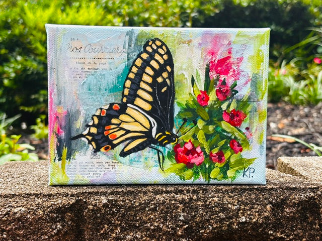 Garden inspired painting of a yellow and black butterfly on red flowers, set outdoors among lush greenery.