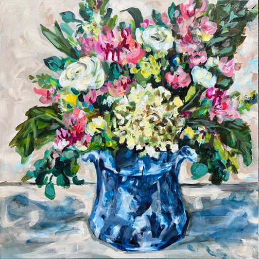 Catherine Husek’s 24x24 gallery wrapped canvas features a blue vase with a vibrant bouquet and green leaves.