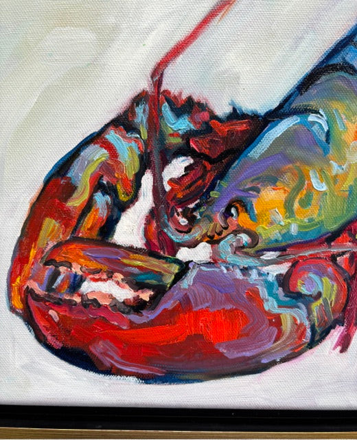 Catherine Huseks vibrant lobster claw art in red, blue, yellow & green on white, framed with a gold float frame.
