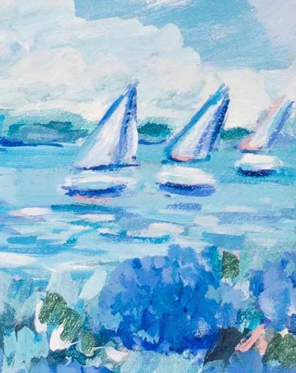 Michelle Brunner sailboats glide on Lake Erie under partly cloudy skies, hydrangeas blooming in the foreground.