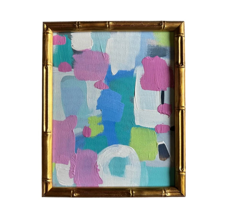 Kelsey Nichols Art framed acrylic painting features pink, blue, green, and white shapes in a gold bamboo-style frame.