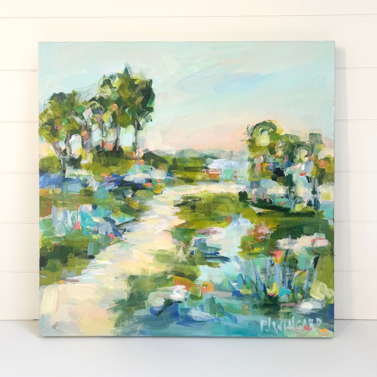 Pamela Wingard Fine Art abstract coastal painting with green trees, blue water, and a pastel sky on gallery canvas.