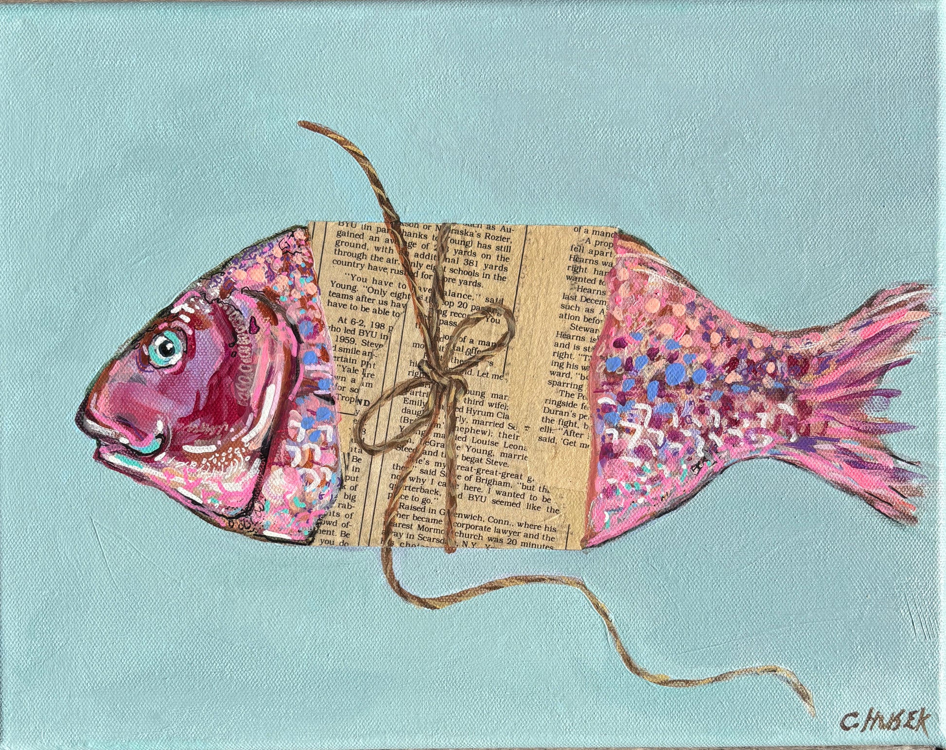 Catherine Husek acrylic painting of a colorful fish in newspaper and string, perfect coastal art on light blue.