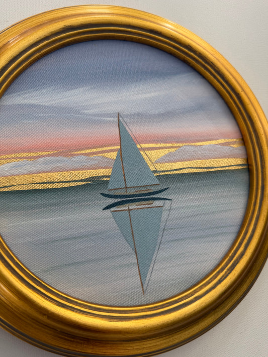 Circular 24K goldleaf painting of a sailboat on calm water at sunset.