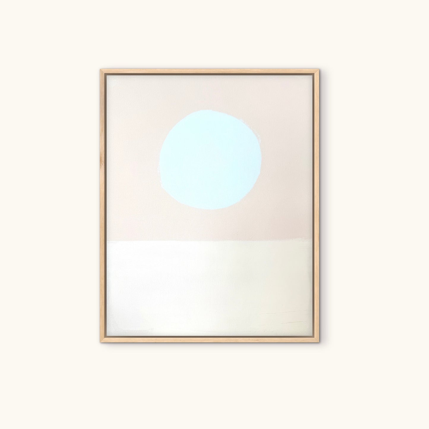 KP Art Collective’s minimalist print features a light blue circle and white band on beige, framed in light wood.