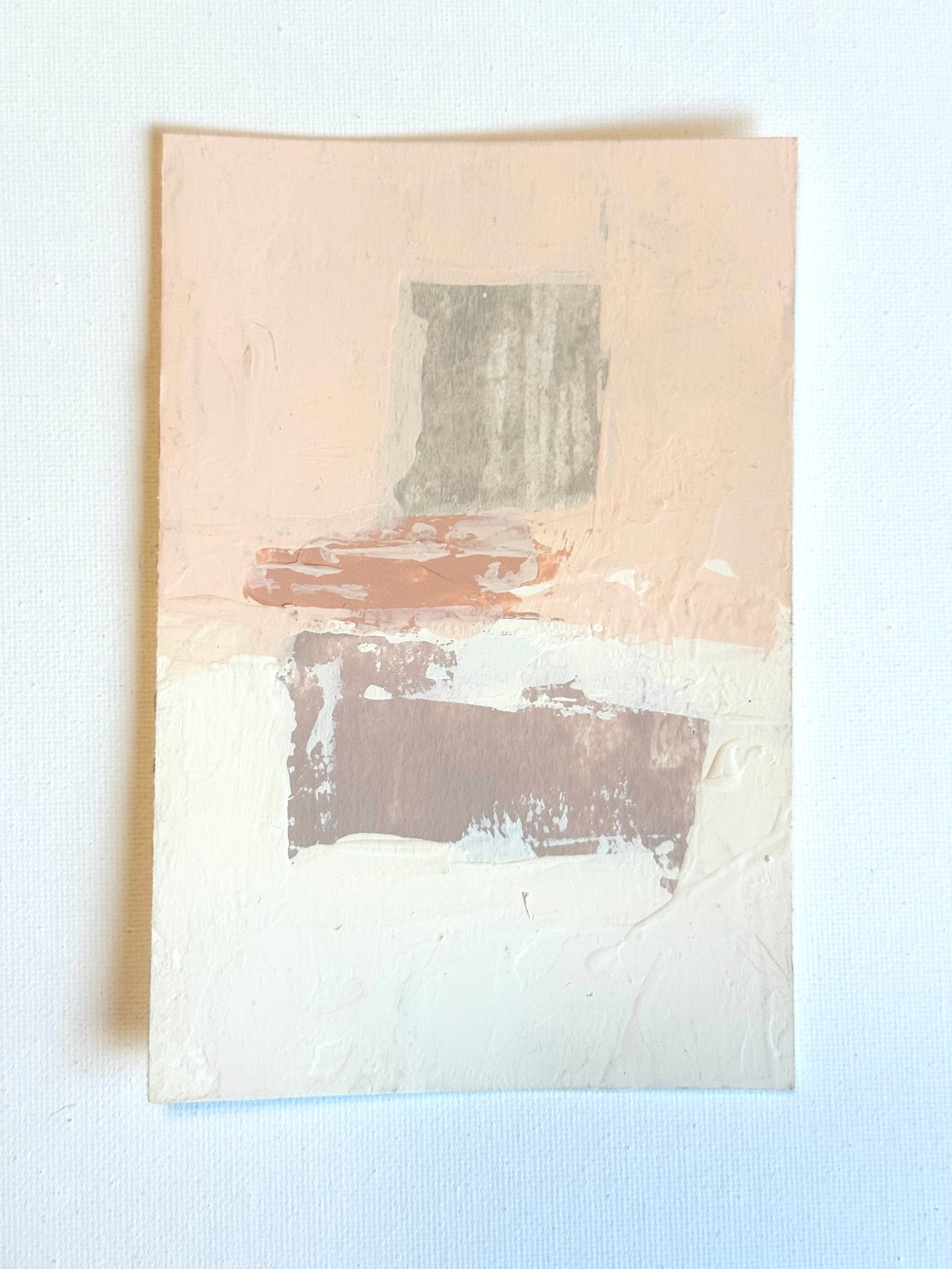 Minimalist art by KP Art Collective: textured layers of pale pink, beige & cream with two rough rectangular shapes.