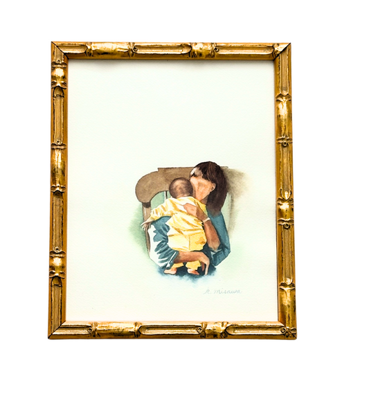 Framed artwork of a woman holding a child on a white background