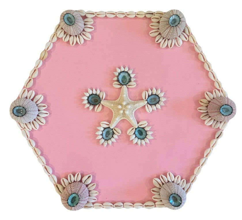 Kelsey Nichols Art hexagon wood tray in pink, with shell art: starfish center, sea urchins at each corner.