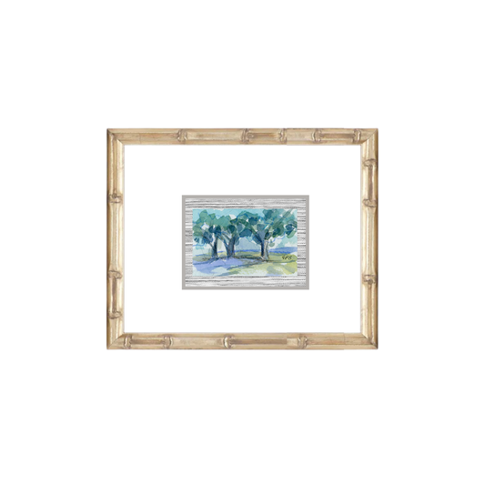 A small Elizabeth Sheats Art & Design watercolor of trees in a light wood frame with a white mat.