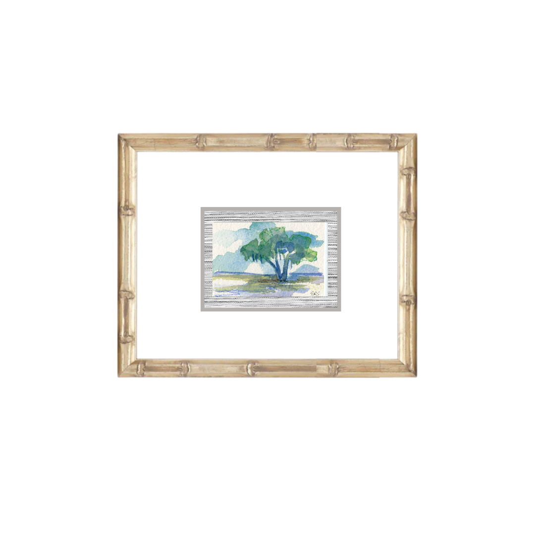 A framed watercolor of a live oak in a grassy field by Elizabeth Sheats Art & Design, bamboo-style wood frame.