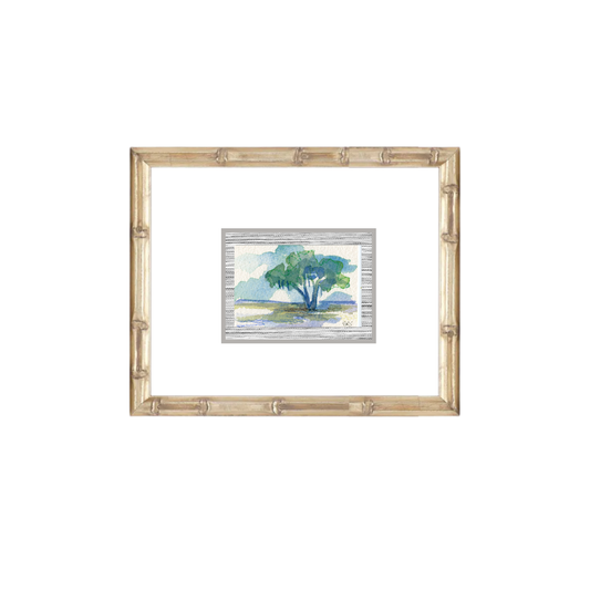 A framed watercolor of a live oak in a grassy field by Elizabeth Sheats Art & Design, bamboo-style wood frame.