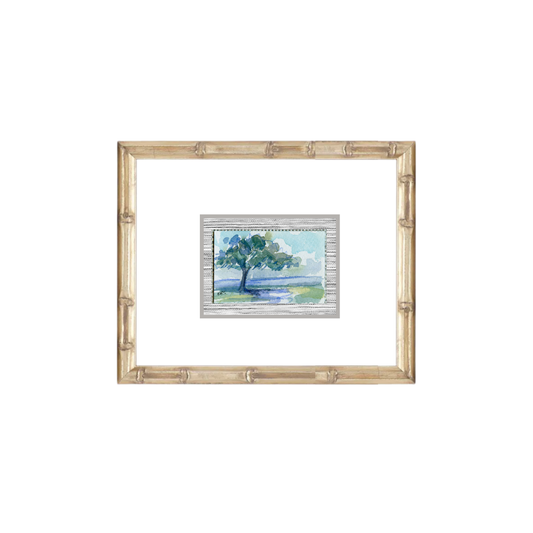 Watercolor of a live oak by water, gold-framed, from Elizabeth Sheats Art & Design.