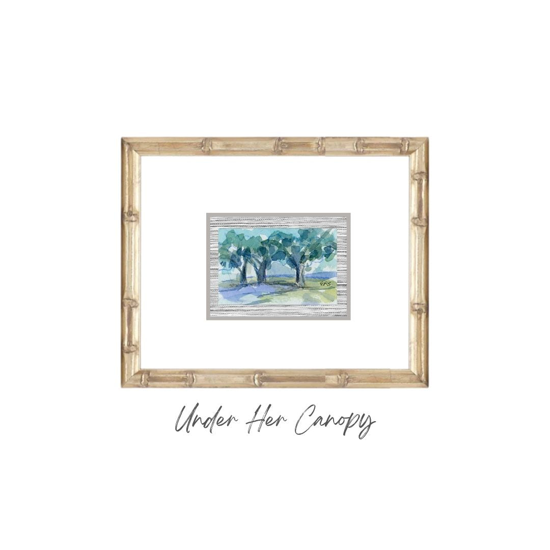 A framed original watercolor of live oaks with Under Her Canopy from Elizabeth Sheats Art & Design.